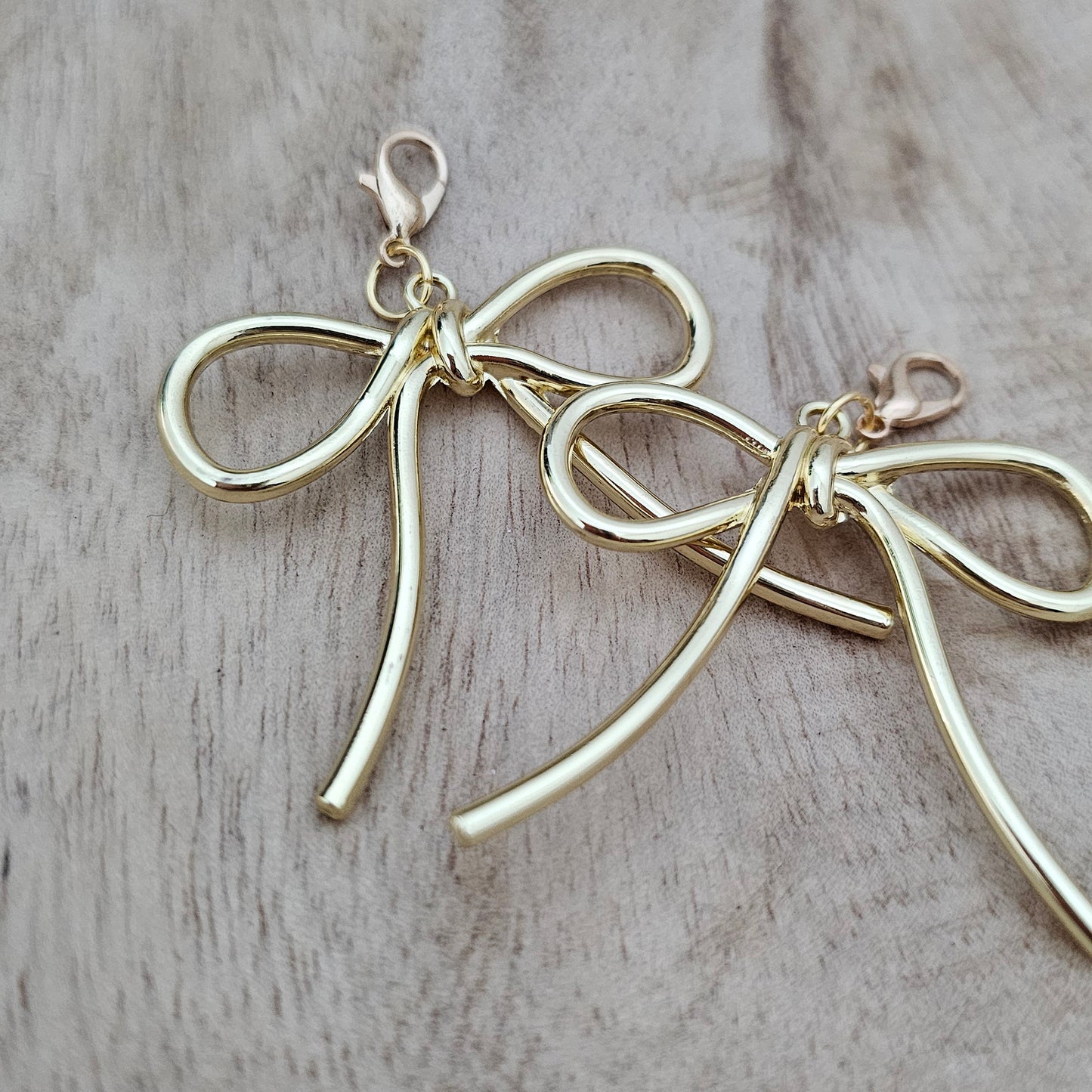 Gold Bow Shoe Charms Close-Up