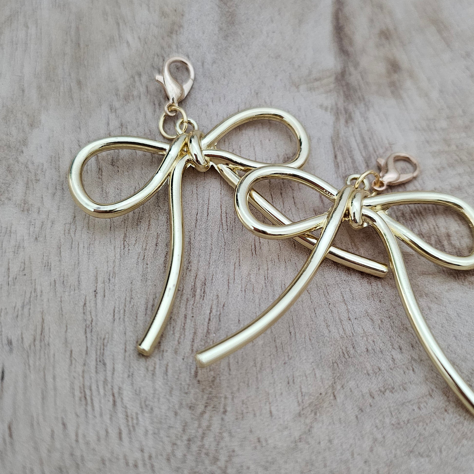 Gold Bow Shoe Charms Close-Up